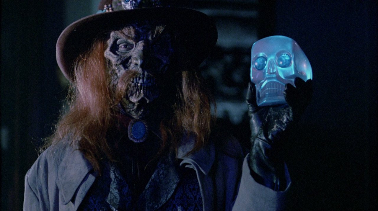 The resurrected Slim holding the crystal skull in House II: The Second Story (1987)