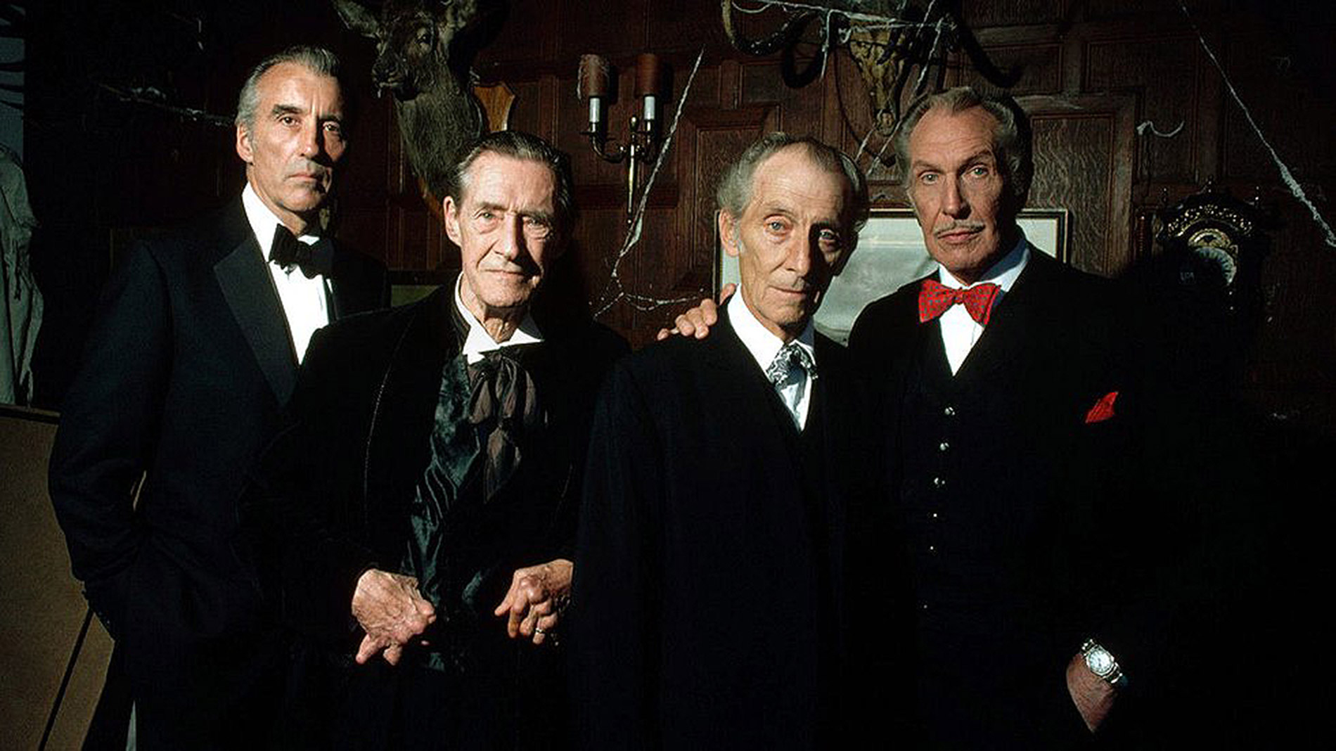 The uniting of four horror legends - (l to r) Christopher Lee, John Carradine, Peter Cushing and Vincent Price in House of the Long Shadows (1983)