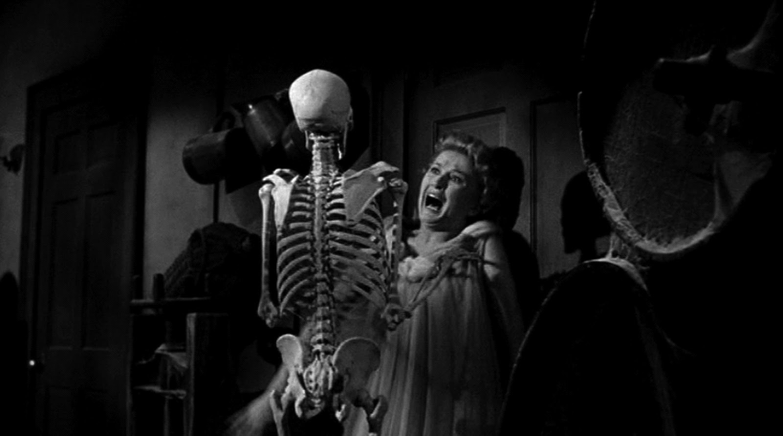 Carol Ohmart attacked by a skeleton in House on Haunted Hill (1959)