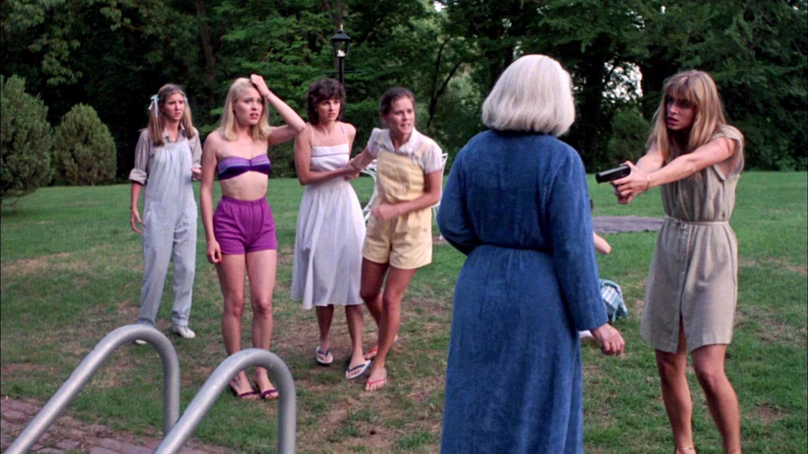 (l to r) Robin Meloy, Jodi Draigie, Ellen Dorsher, Kate McNeil and Eileen Davidson force Lois Kelso Hunt into the pool at gunpoint in The House on Sorority Row (1982)