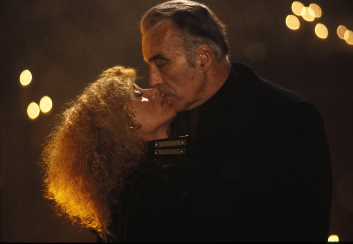 Stirba (Sybil Danning) and Stefan (Christopher Lee) share a kiss in The Howling II (1985)