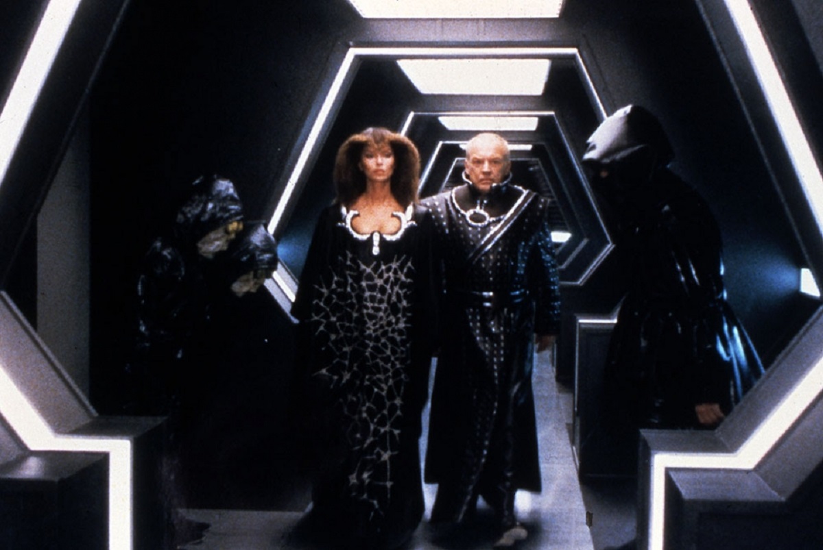 Lady Agatha (Barbara Bach) and Kraspin (Arthur Kennedy) in The Humanoid (1979)