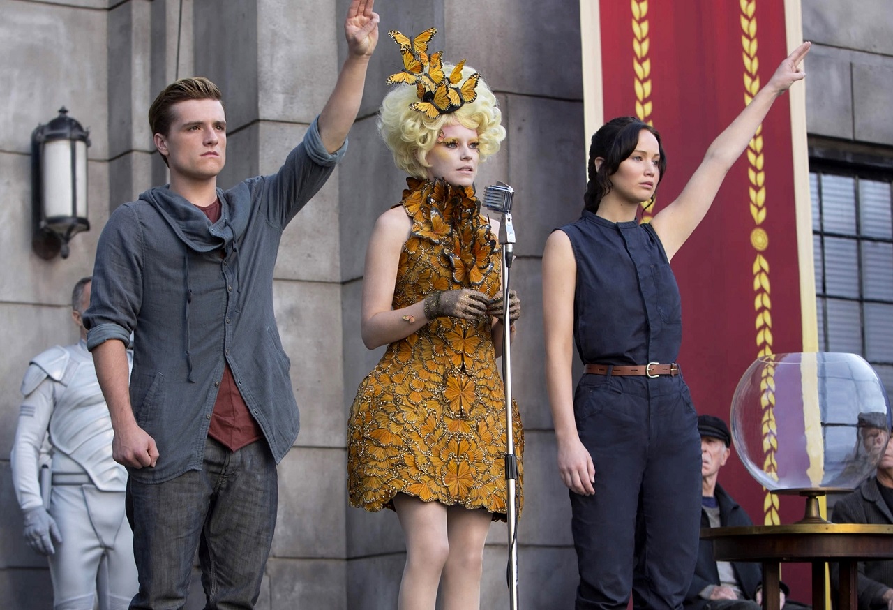 Peeta Mellark (Josh Hutcherson) Effie Trinket (Elizabeth Banks) and Katniss Everdeen (Jennifer Lawrence) in The Hunger Games: Catching Fire (2013)