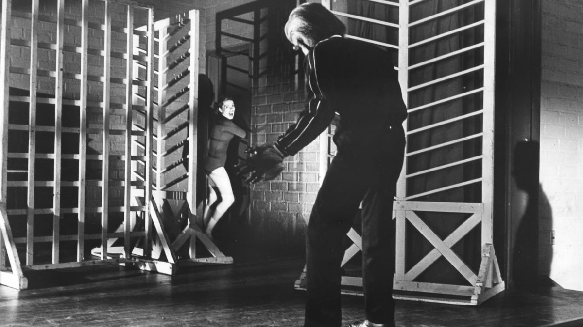 Michael Landon pursues a girl through a gymnasium in I Was a Teenage Werewolf (1957)