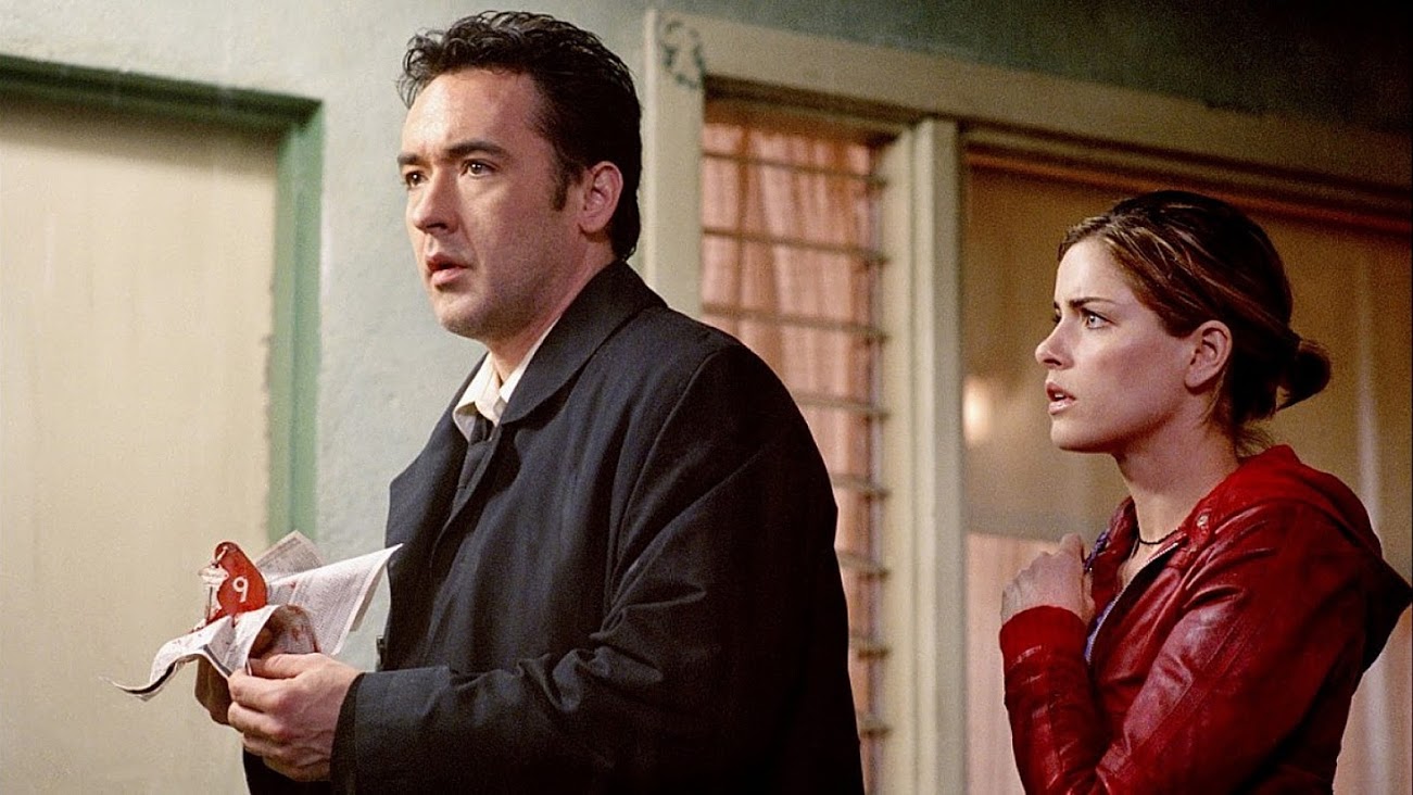 John Cusack and Amanda Peet in Identity (2003)