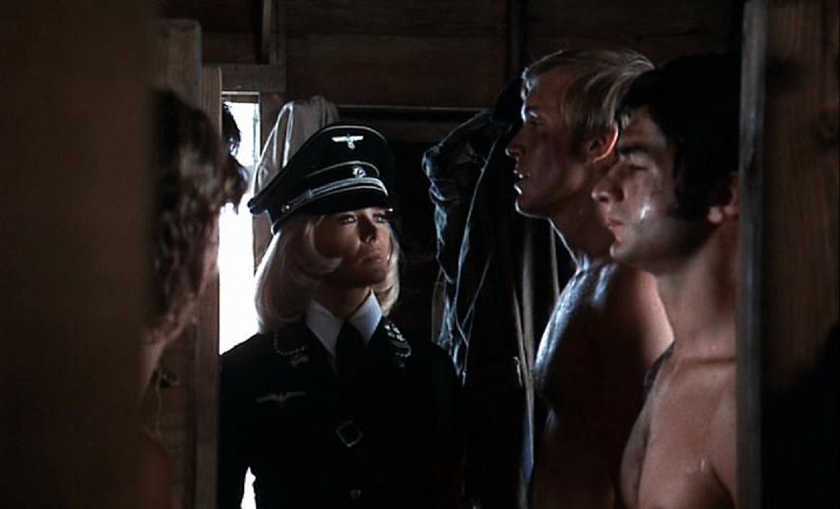 Ilsa (Dyanne Thorne) surveys the prisoners in Ilsa, She Wolf of the SS (1974)