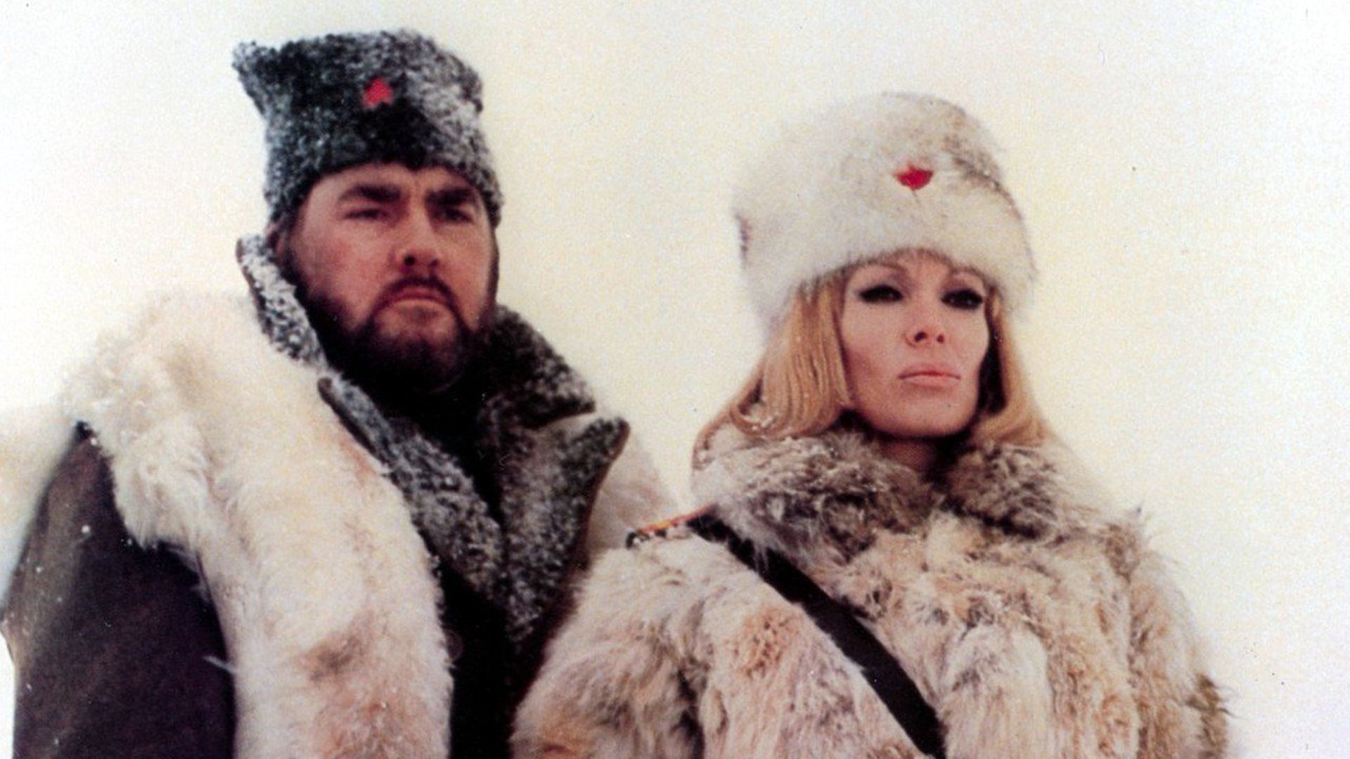 Dyanne Thorne as the commandant of a Soviet gulag in Ilsa, The Tigress of Siberia (1977)