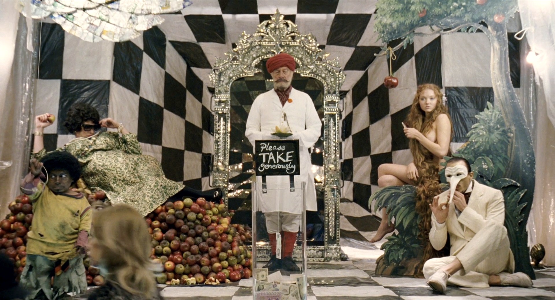 Dr Parnassus (Christopher Plummer) (standing centre) offers the way beyond the mirror. With Lily Cole and Heath Ledger (in mask) to his right in The Imaginarium of Doctor Parnassus (2009)
