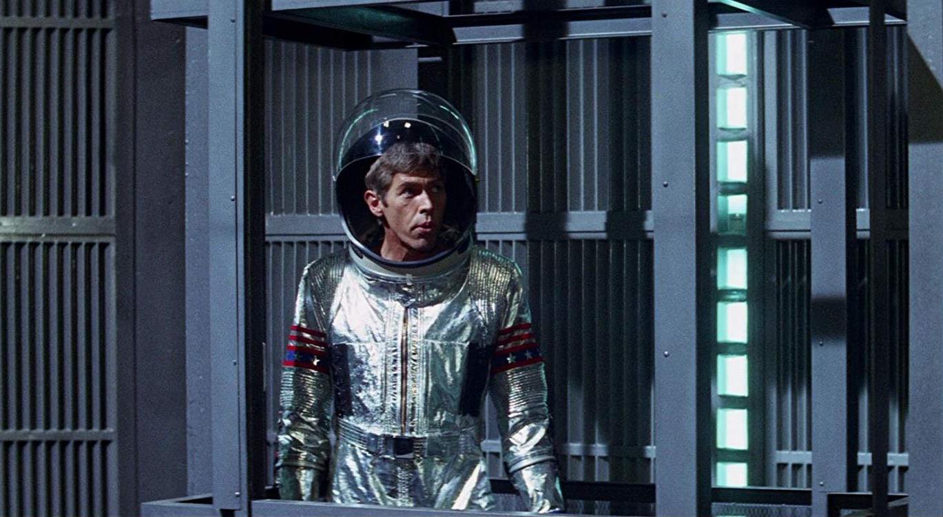 Derek Flint (James Coburn) prepares to travel into space in In Like Flint (1967)
