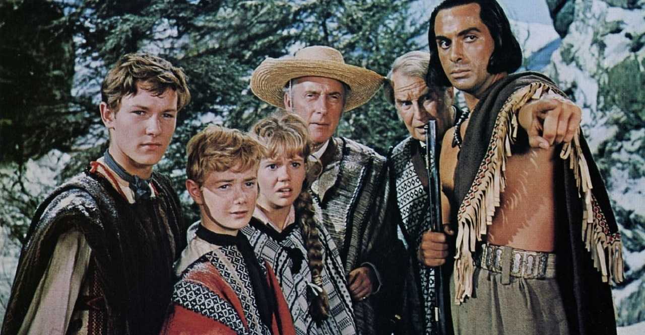John Glenarvan (Michael Anderson Jr), Robert Grant (Keith Hamshire), Mary Grant (Hayley Mills), Lord Glenarvan (Wilfrid Hyde White), Professor Jacques Paganel (Maurice Chevalier) and the Indian guide Thalcave (Antonio Cifariello) in In Search of the Castaways (1962)