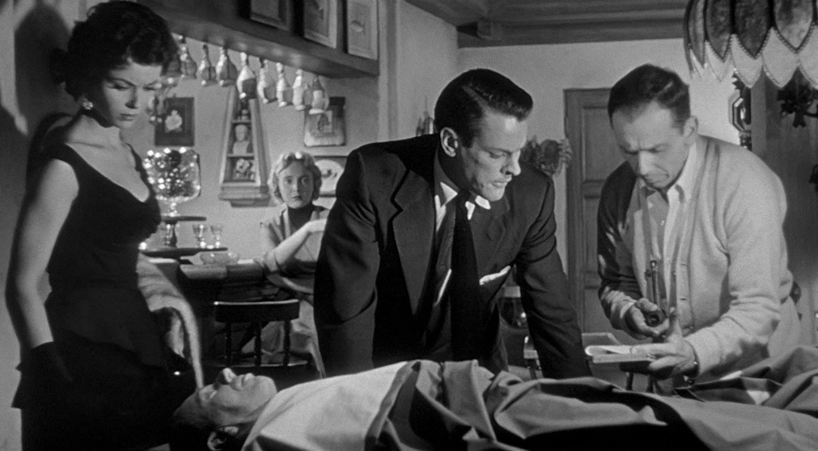 Dana Wynter, Kevin McCarthy and King Donovan examine the blank duplicate of Donovan in Invasion of the Body Snatchers (1956)