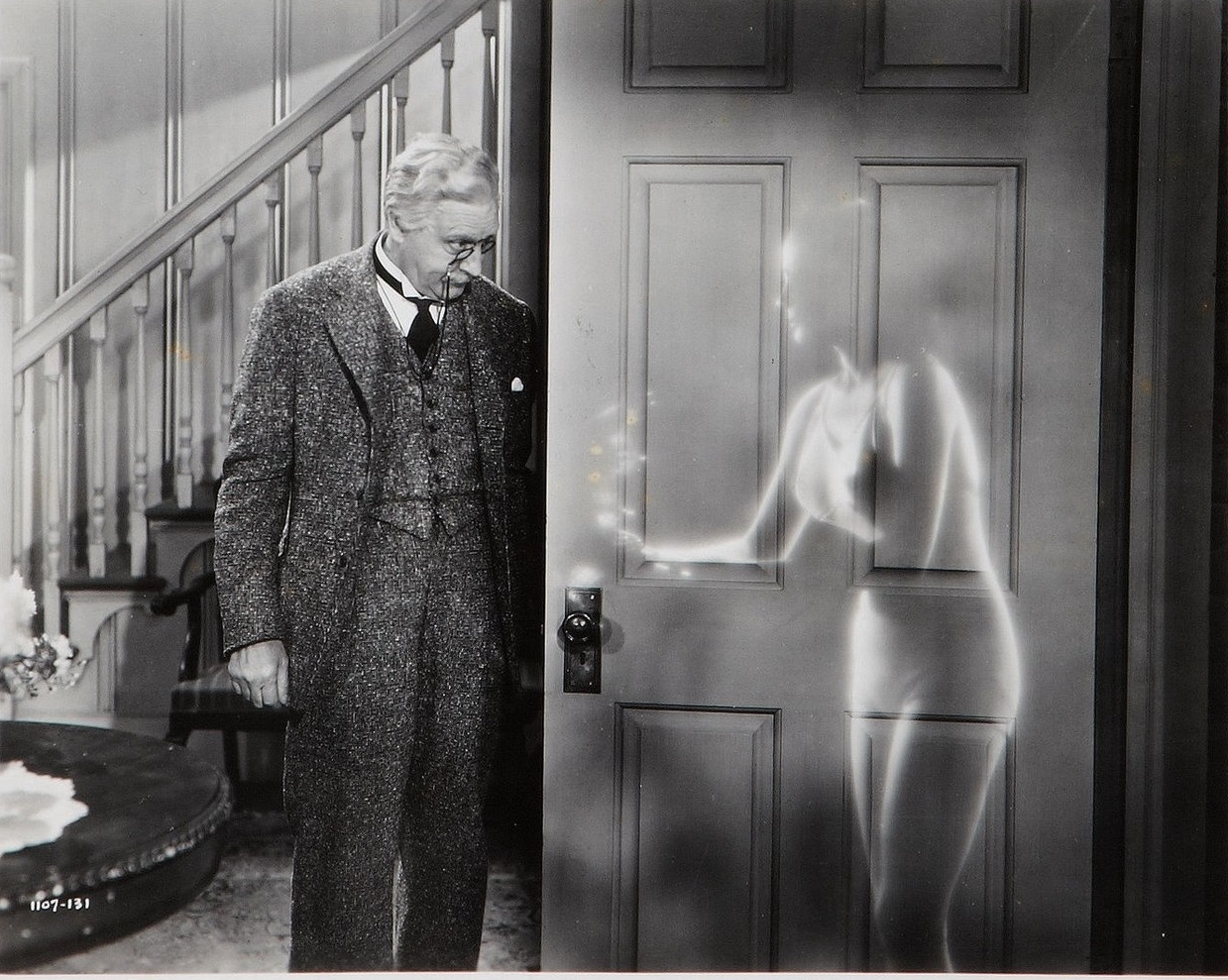 John Barrymore and an invisible Virginia Bruce in The Invisible Woman (1940)