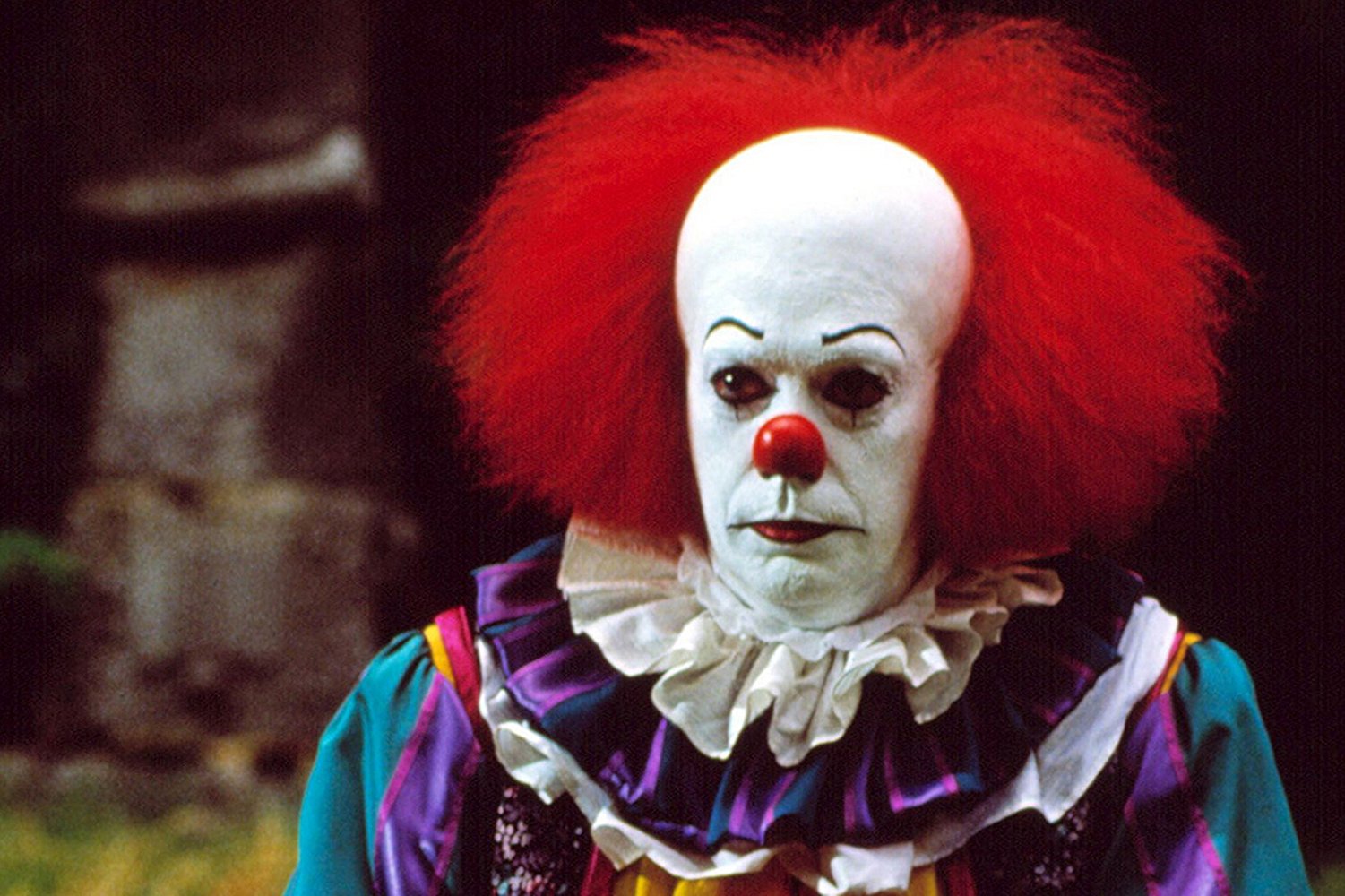 Tim Curry as Pennywise in It (1990)