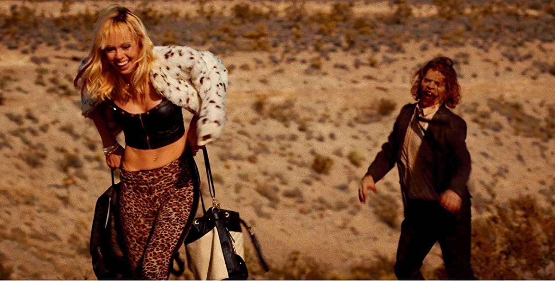Brittany Allen makes her way through the desert pursued by the zombie Smalls (Juan Riedinger) in It Stains the Sand Red (2016)