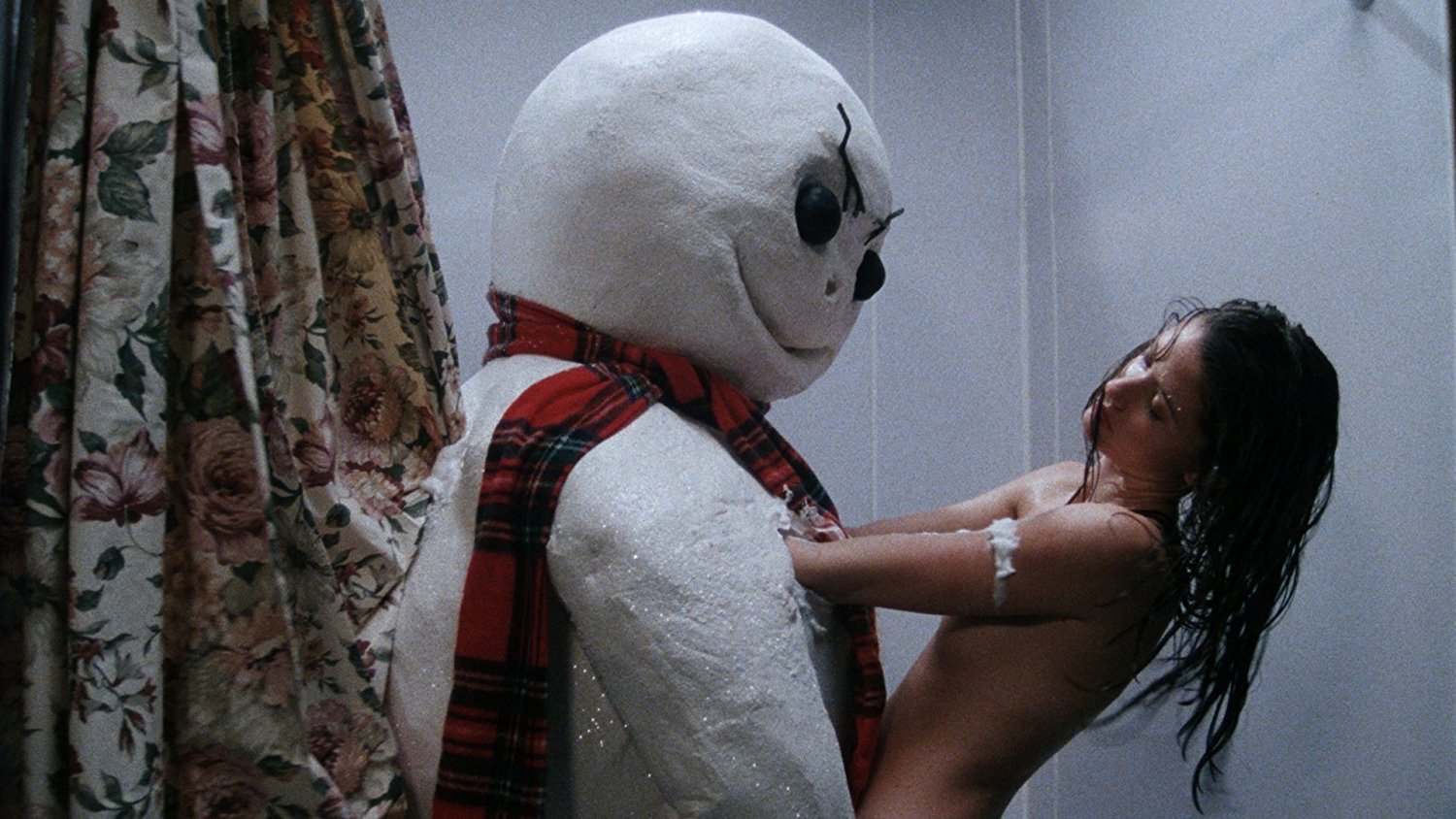 The killer snowman joins Shannon Elizabeth Fadal for a shower in Jack Frost (1997)