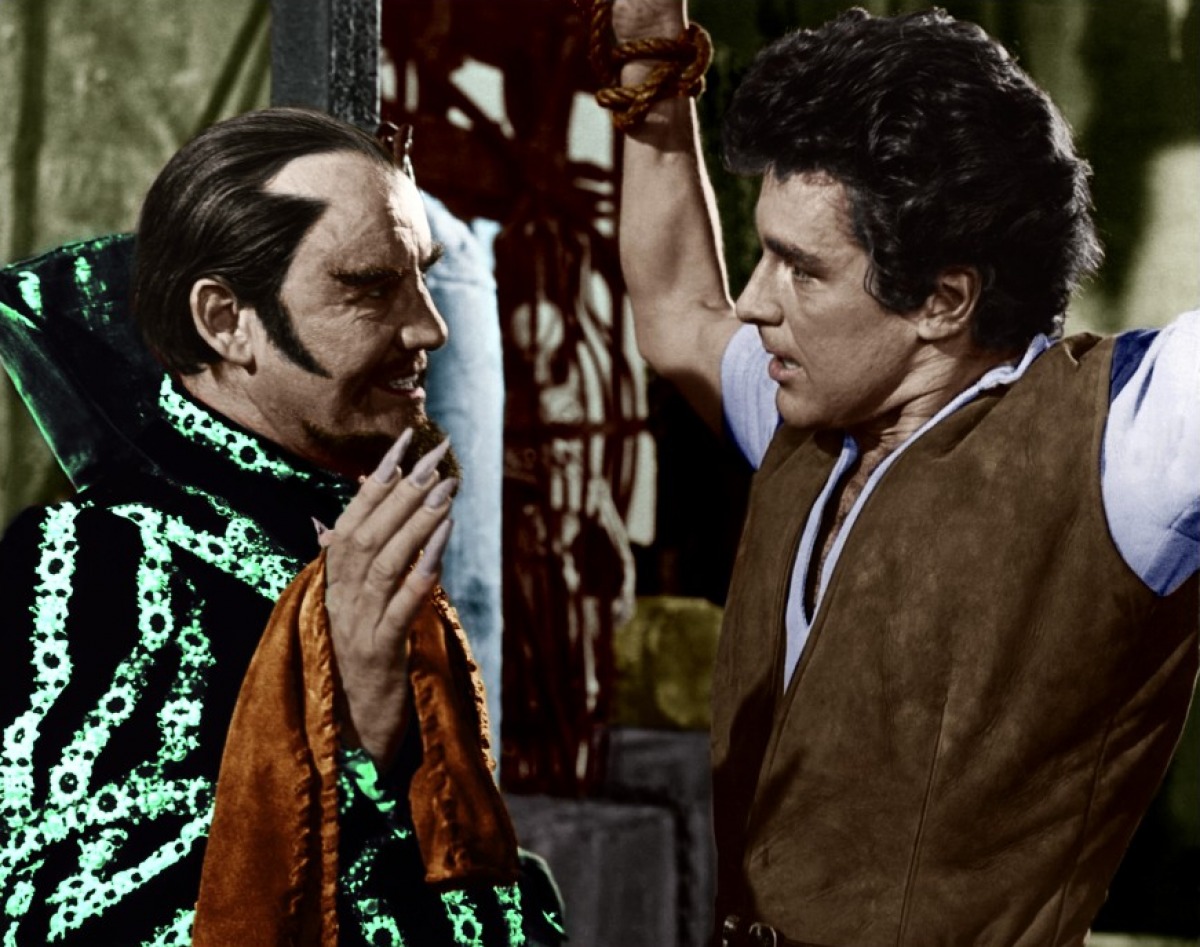 (l to r) The sorcerer Pendragon (Torin Thatcher) has Jack (Kerwin Mathews) prisoner in Jack the Giant Killer (1962)