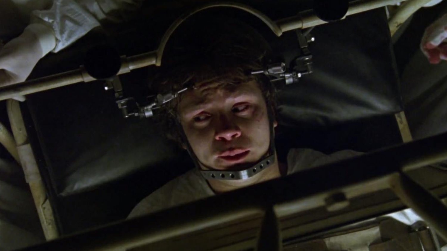 Jacob (Tim Robbins) drawn into a nightmare in which he is tortured in a hospital in Jacob's Ladder (1990)