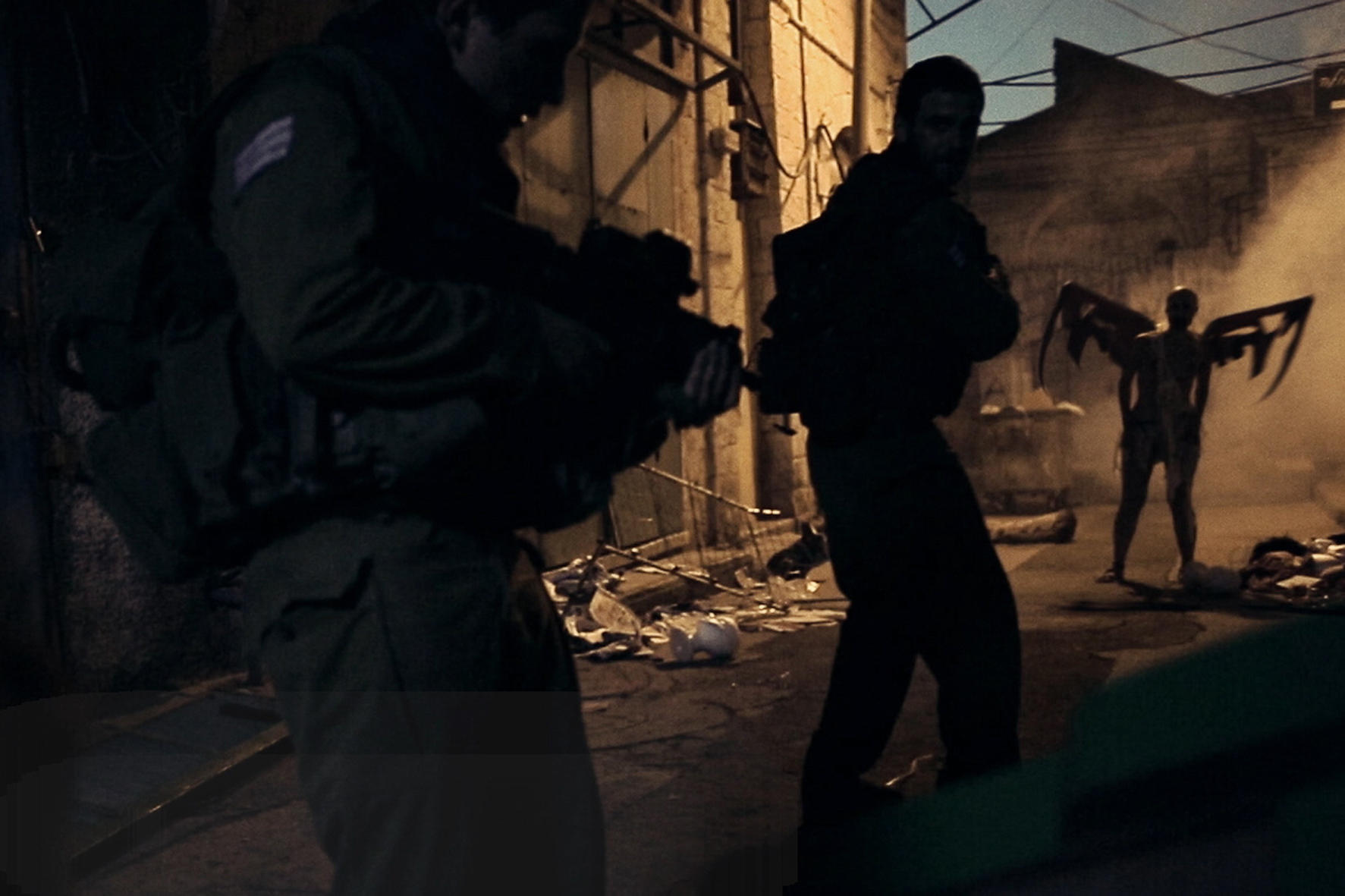 Soldiers vs winged demon figures in Jeruzalem (2015)