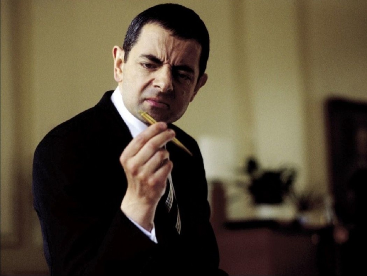 Rowan Atkinson as Johnny English (2003)