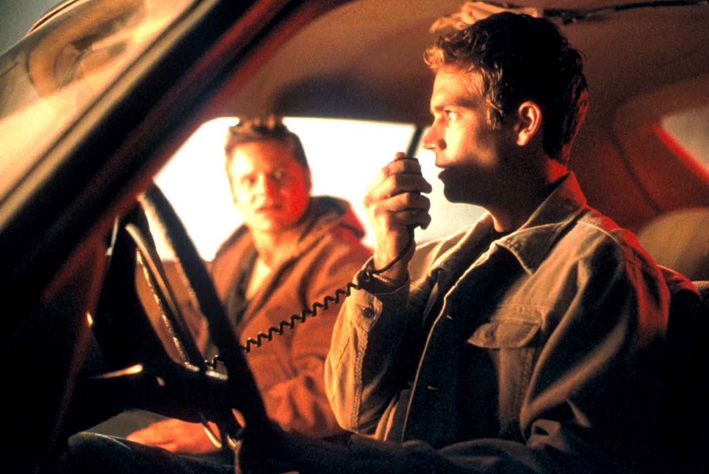 Brothers Steve Zahn and Paul Walker fool around with a CB radio in Joy Ride (2001)