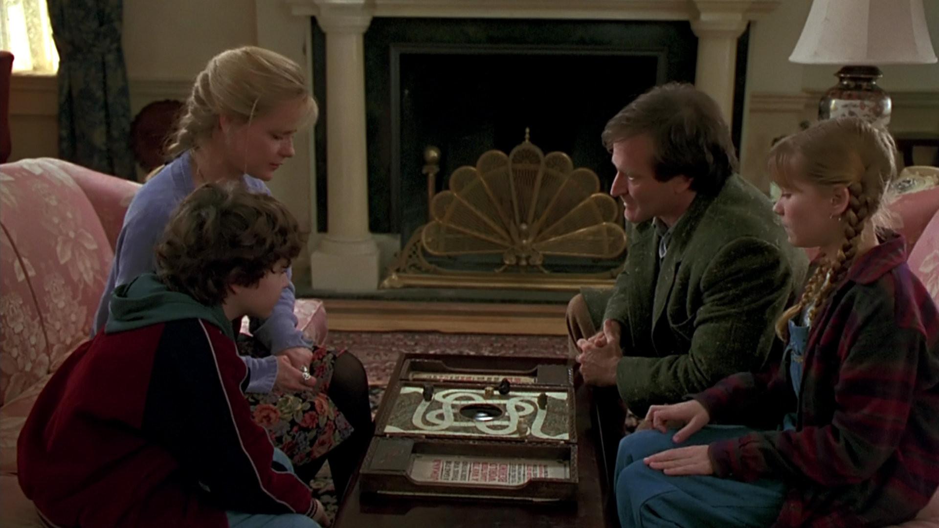 Sitting down to play the boardgame - Bradley Pierce, Bonnie Hunt, Robin Williams, Kirsten Dunst in Jumanji (1995)