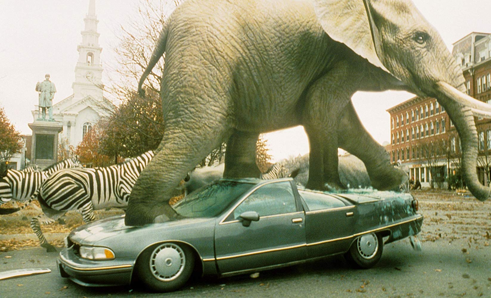 An elephant stampede unleashed in a small town by the boardgame in Jumanji (1995)