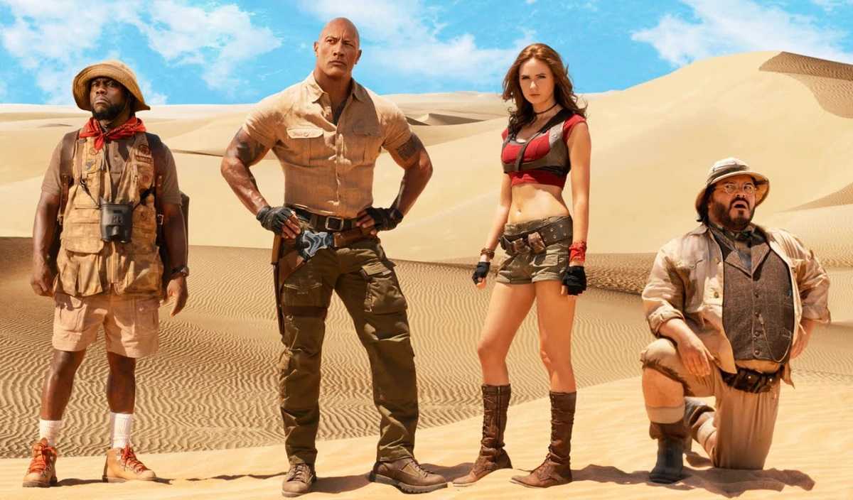 Franklin ‘Mouse’ Finbar (Kevin Hart), Dr Xander Bravestone (Dwayne Johnson), Ruby Roundhouse (Karen Gillan) and Professor Sheldon Oberon (Jack Black) in Jumanji: The Next Level (2019)