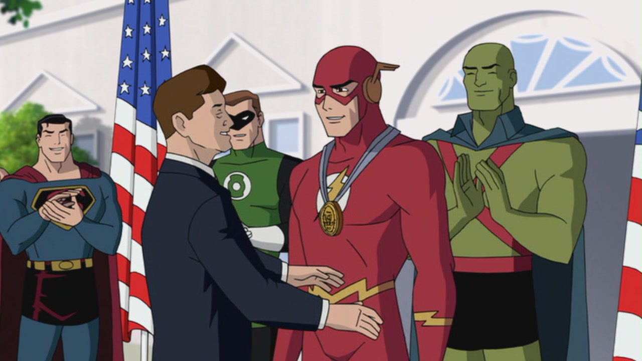 President Kennedy presents The Flash with a medal flanked by Superman, Green Lantern and J'onn J'onnz in Justice League: The New Frontier (2008)