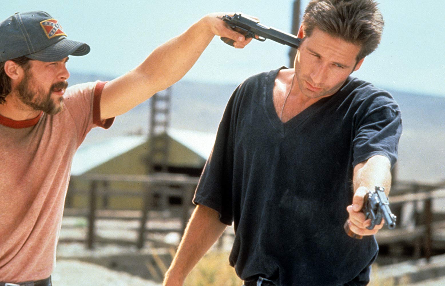 Brad Pitt pulls a gun on David Duchovny in Kalifornia (1993)