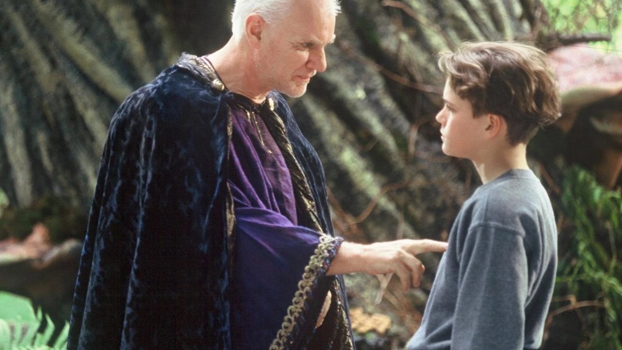 Merlin (Malcolm McDowell) with Alex (Johnny Morina) in Kids of the Round Table (1995)