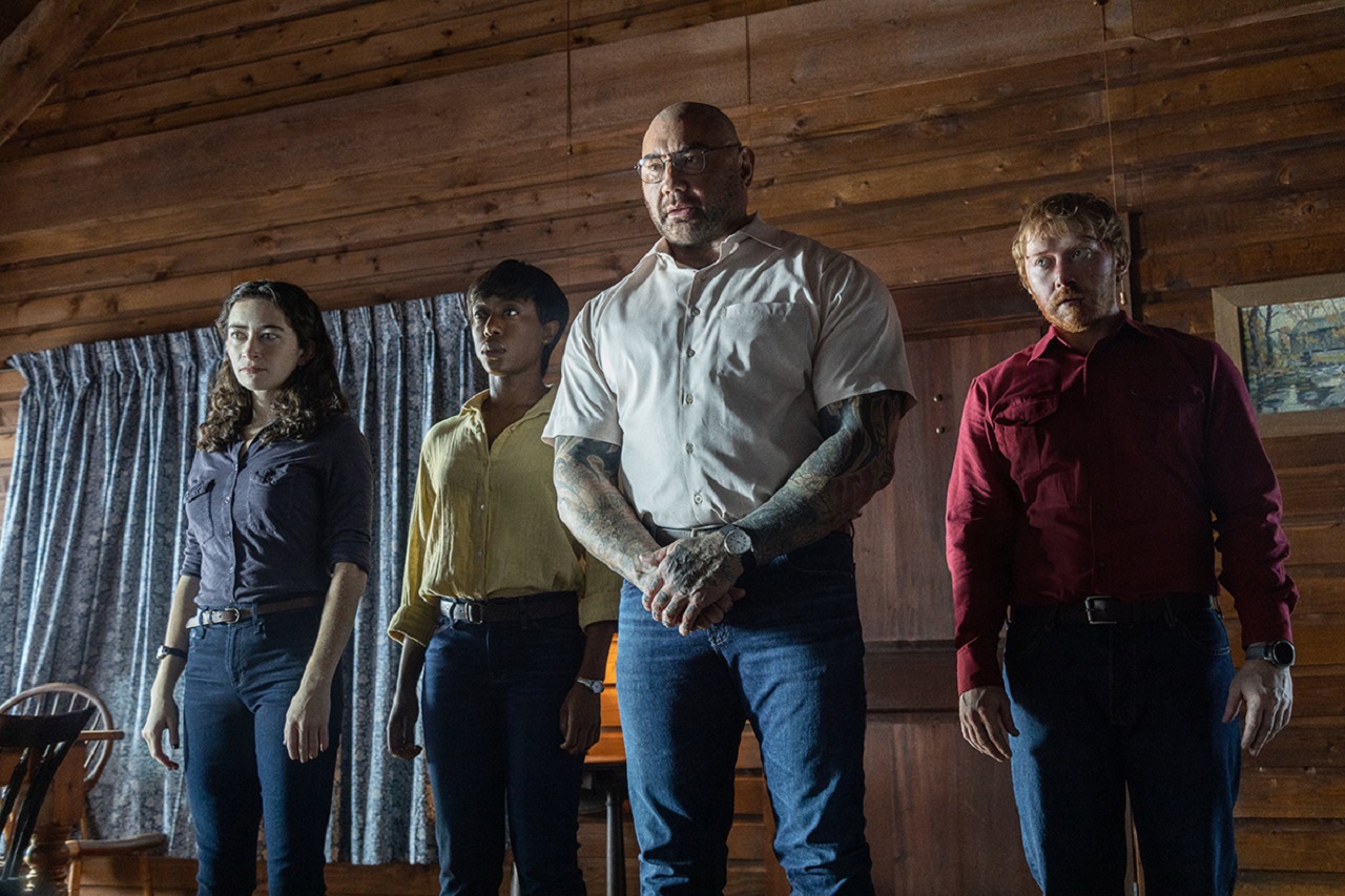 The strangers at the cabin - Abby Quinn, Nikki Amuka-Bird, Dave Bautista and Rupert Grint in Knock at the Cabin (2023)