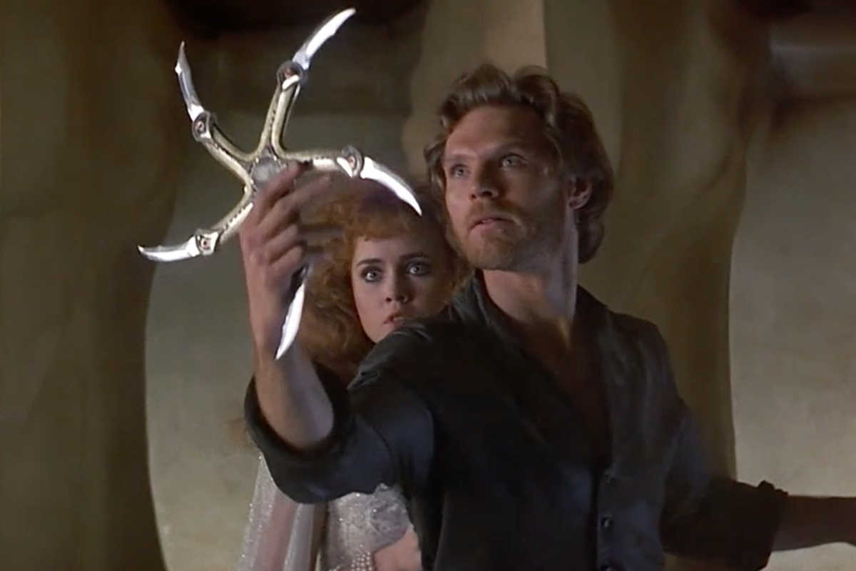 Prince Colwyn (Ken Marshall) wielding his glaive and Princess Lyssa (Lysette Anthony) in Krull (1983)