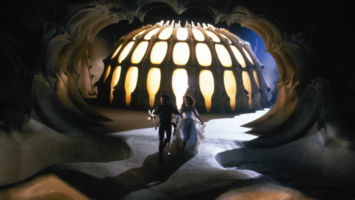 Colwyn (Ken Marshall) and Lyssa (Lysette Anthony) make an escape through The Black Fortress in Krull (1983)