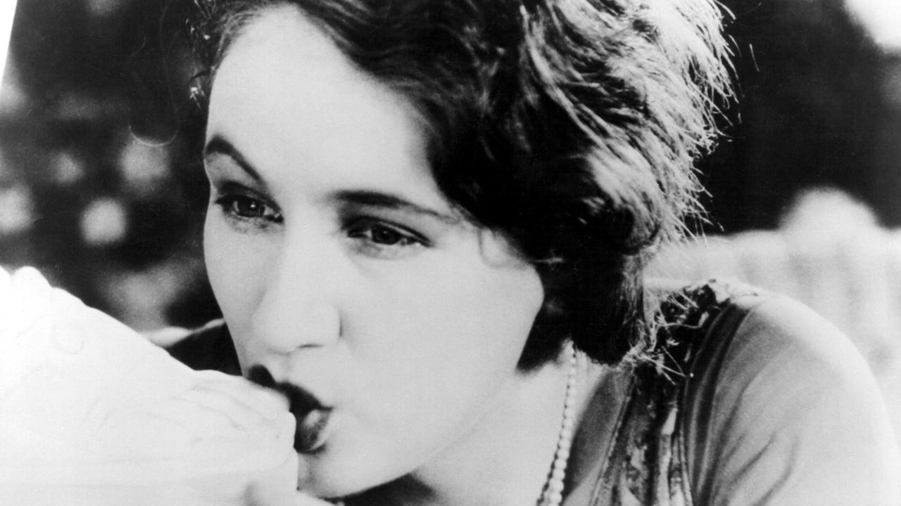 An erotically thwarted Lya Lys seeks relief by sucking the toe of a statue in L'Age d'Or (1930)