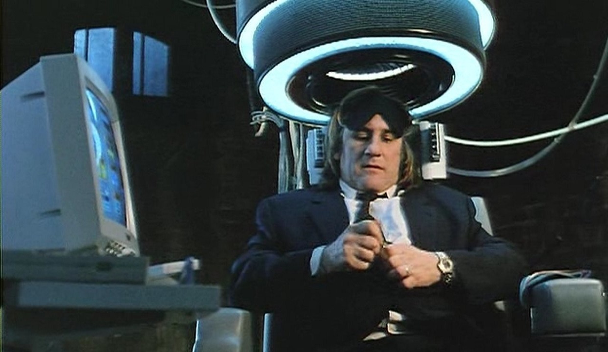 Gerard Depardieu prepares to activate the machine that allows him to swap bodies in La Machine (1994)