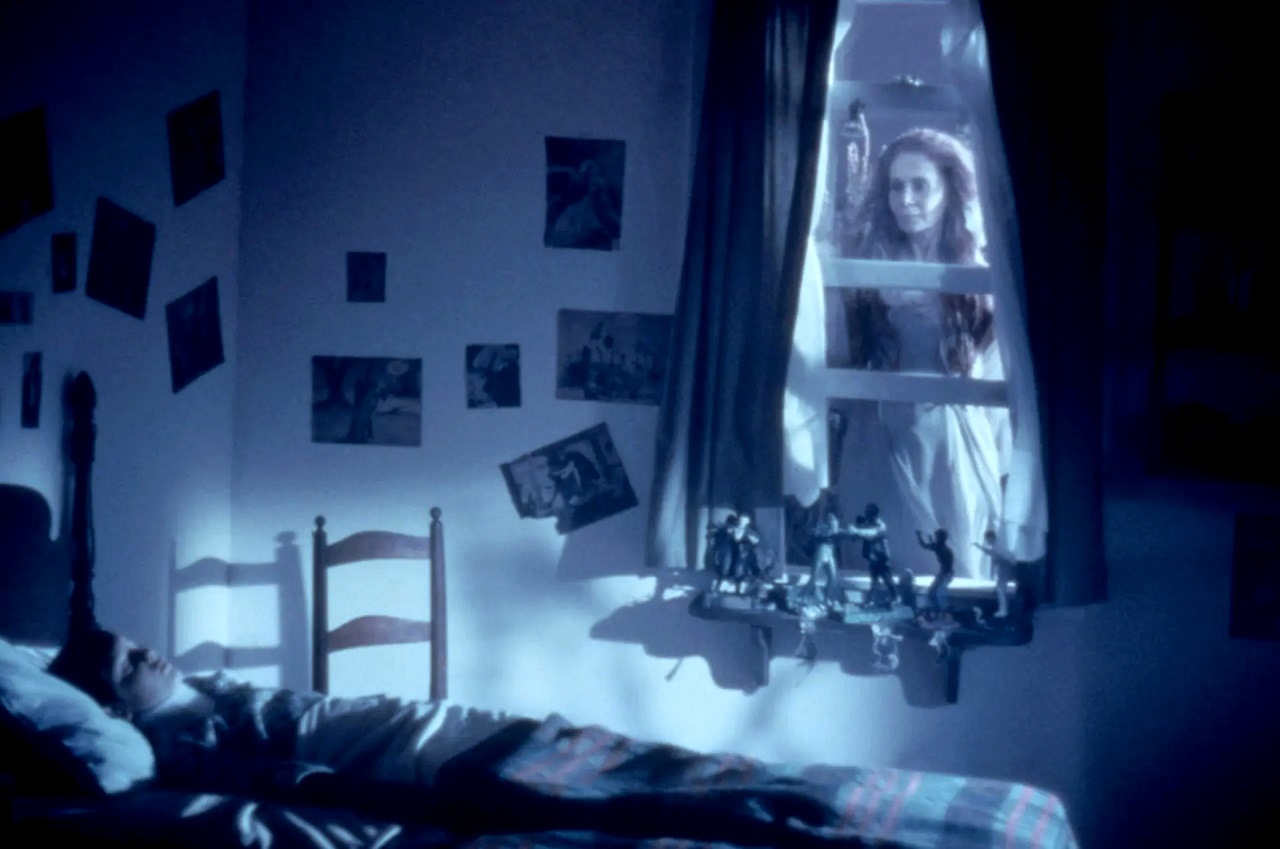 Ghost lady Katherine Helmond hovers at Lukas Haas's window in Lady in White (1988)