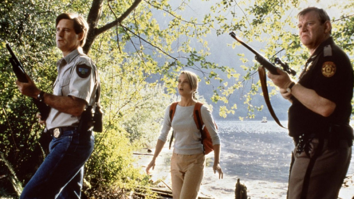 (l to r) Bill Pullman, Bridget Fonda and Brendan Gleeson investigate the crocodile attacks in Lake Placid (1999)