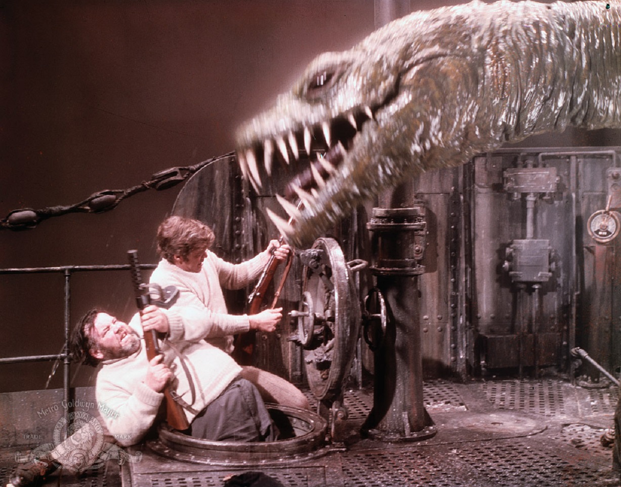 Declan Mulholland and Doug McClure fight off a dinosaur aboard the submarine in The Land That Time Forgot (1974)