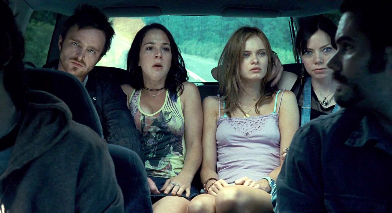 Innocent teens Martha MacIsaac and Sara Paxton take a ride with Aaron Paul, Riki Lindhome and Garrett Dillahunt in The Last House on the Left (2009)