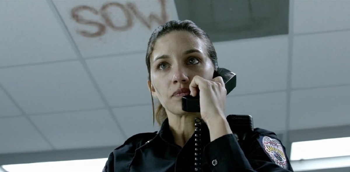 Rookie cop Juliana Harkavy left alone on duty in an abandoned police station in Last Shift (2014)