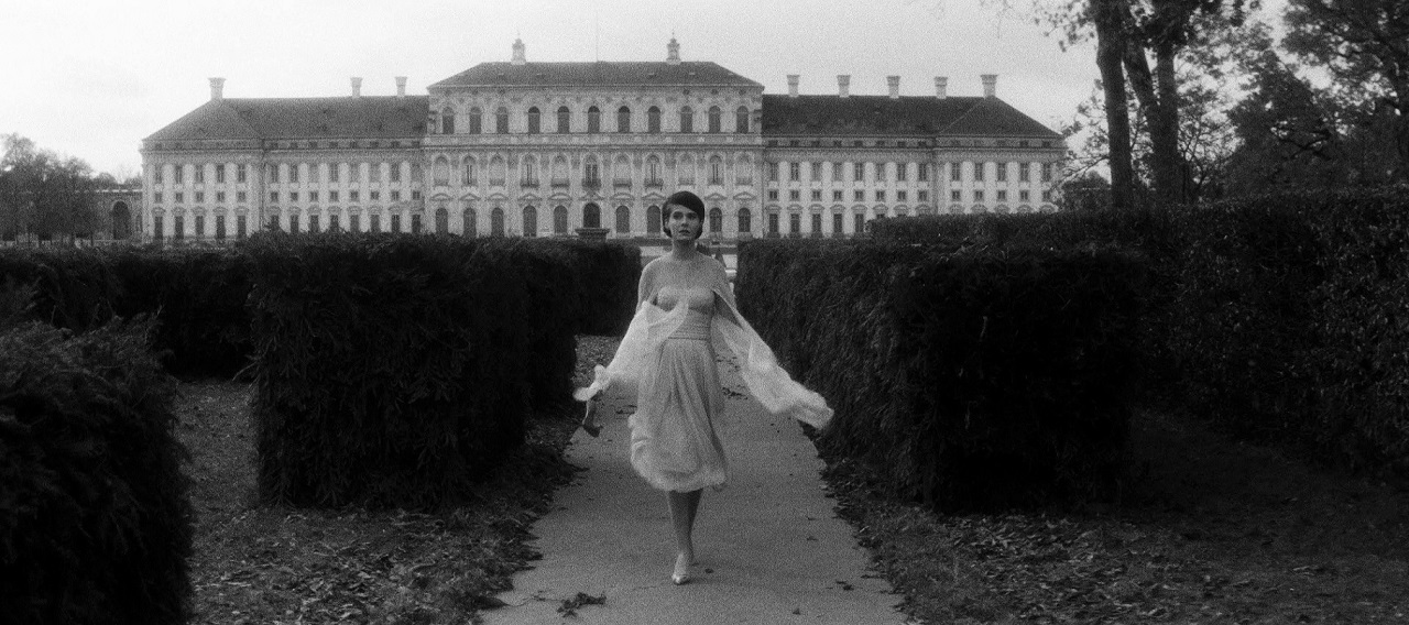 A (Delphine Seyrig) runs through the grounds of the hotel (the Schleissheim Palace in Munich) in Last Year at Marienbad (1961)