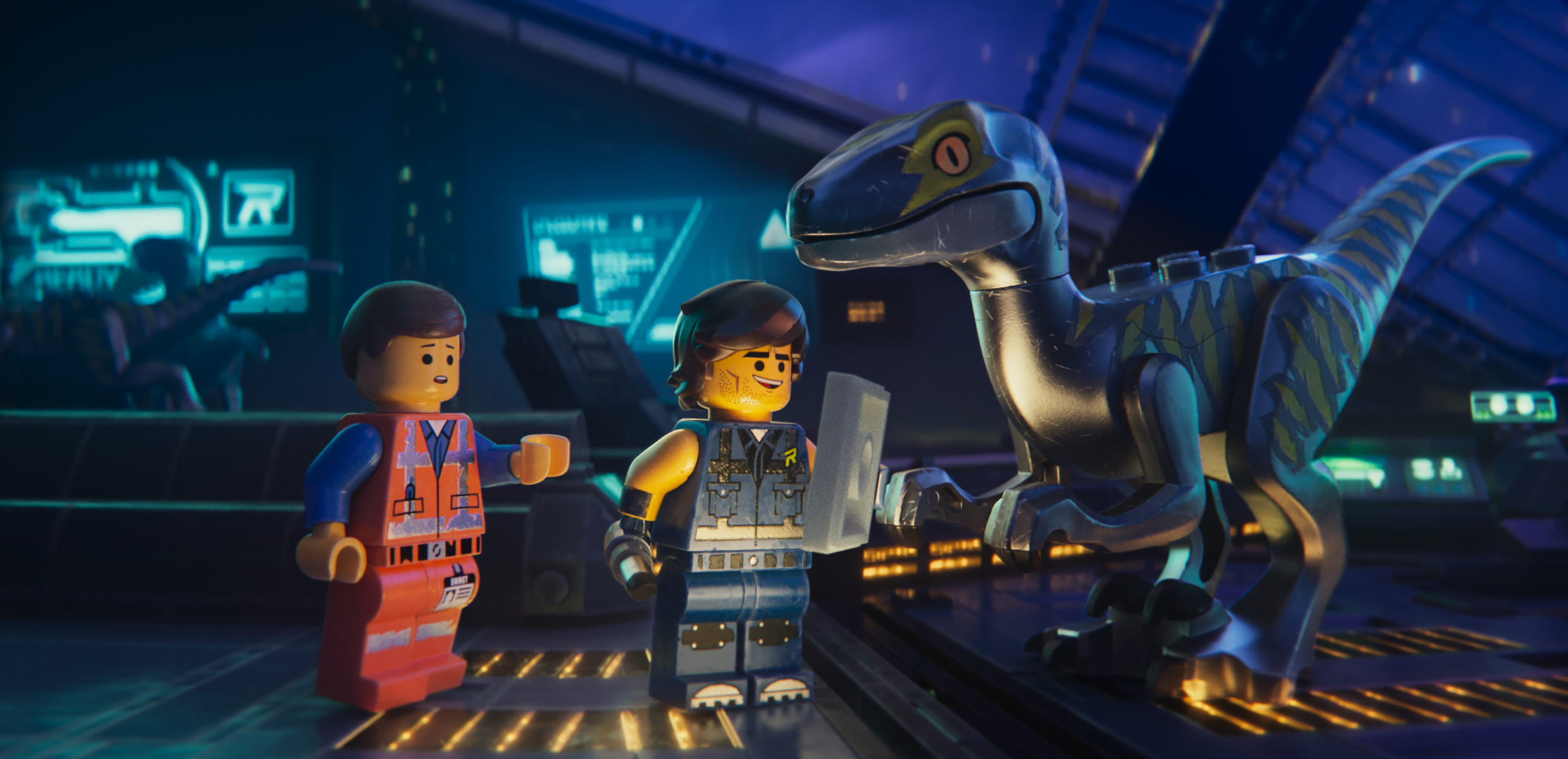 Emmet meets Rex Dangervest (both voiced by Chris Pratt) and one of Rex's trained raptors in The Lego Movie 2 (2019)