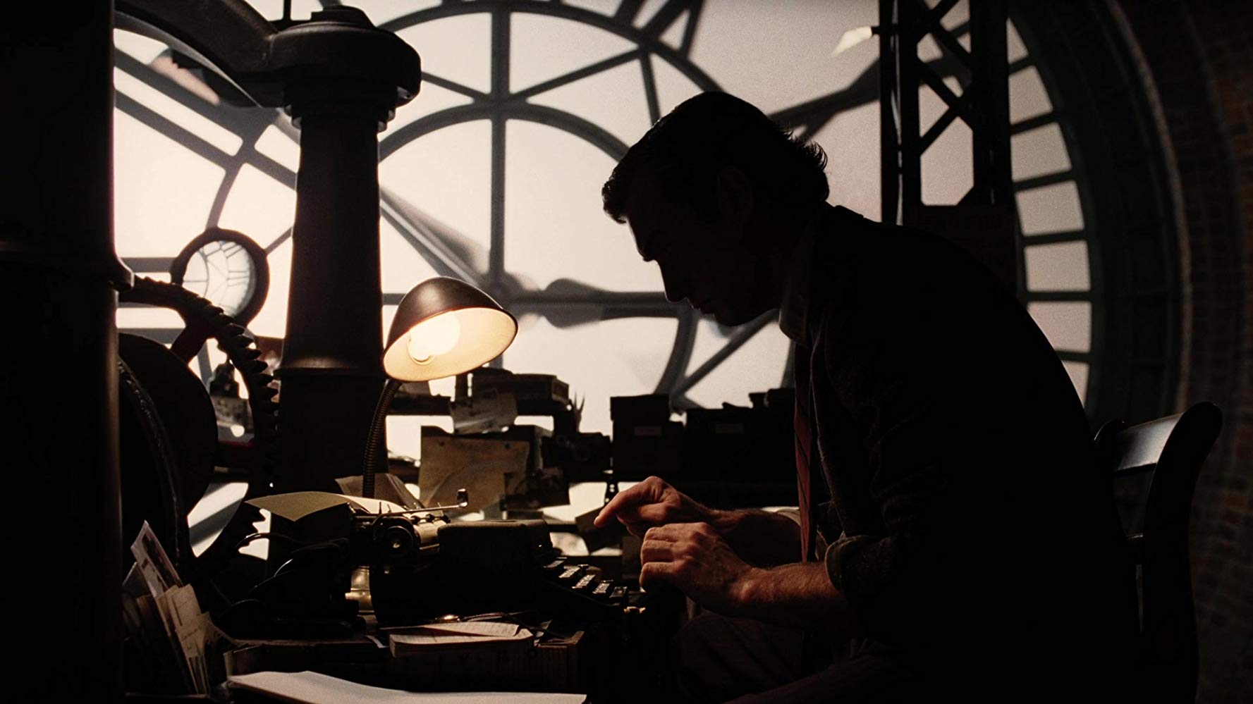 Lemony Snicket (Jude law) sits writing in his clocktower in Lemony Snicket's A Series of Unfortunate Events (2004)