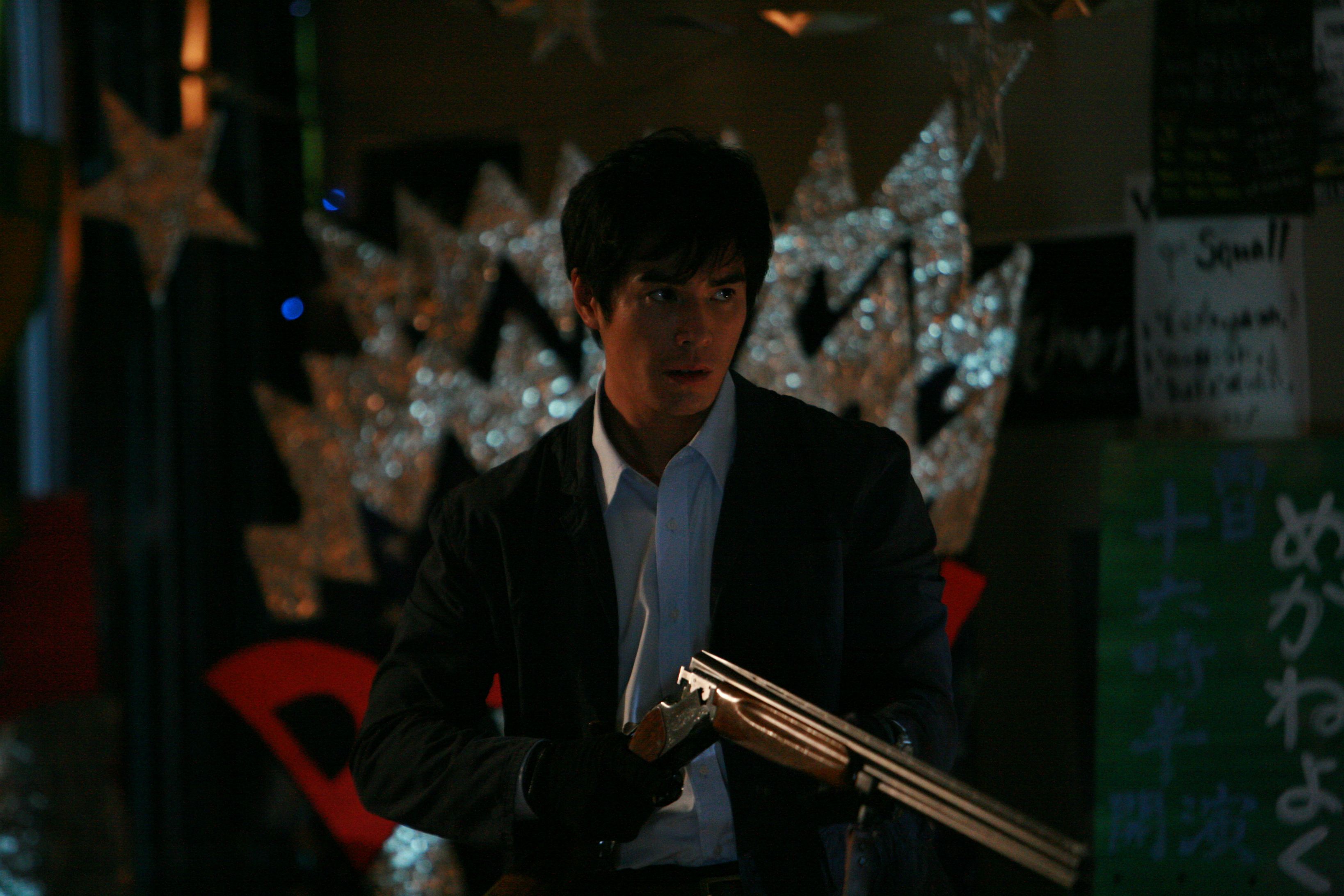 Teacher Hideaki Ito readies his shotgun in Lesson of the Evil (2012)