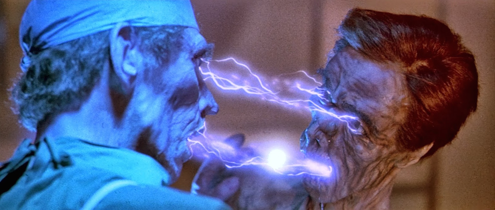 One of the space vampires sucks out a victim's lifeforce in Lifeforce (1985)