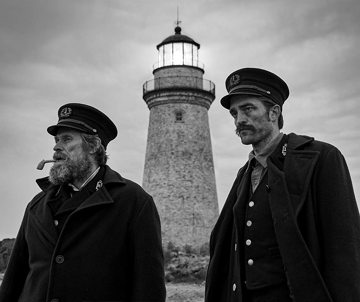 (l to r) Lighthouse keeper Thomas Wake (Willem DaFoe) and new assistant Ephraim Winslow (Robert Pattinson) in The Lighthouse (2019)