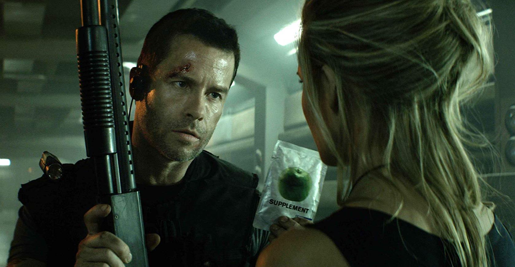 Snow (Guy Pearce) in action to save The President's daughter (Maggie Grace) in Lockout (2012)