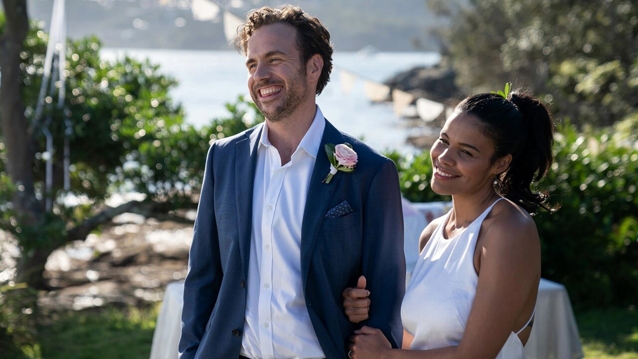 Rafe Spall and Zahra Newman on their wedding day in Long Story Short (2021)