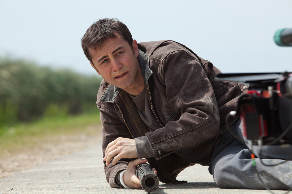 Joe (Joseph Gordon-Levitt) caught in the middle of a temporal conundrum hunting himself in Looper (2012)