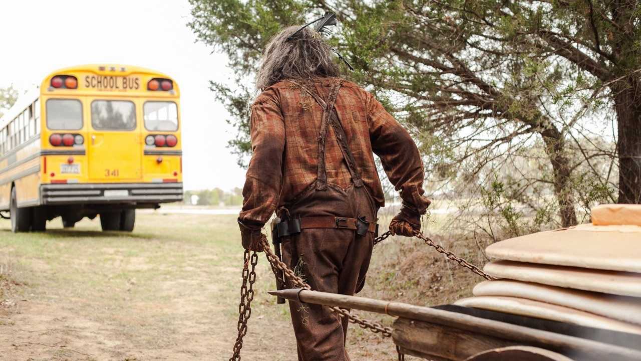 Undead lumberjack Nehemiah Easterday (Brandon Ford) follows the school bus dragging his cart of giant pancakes in Lumberjack Man (2015)